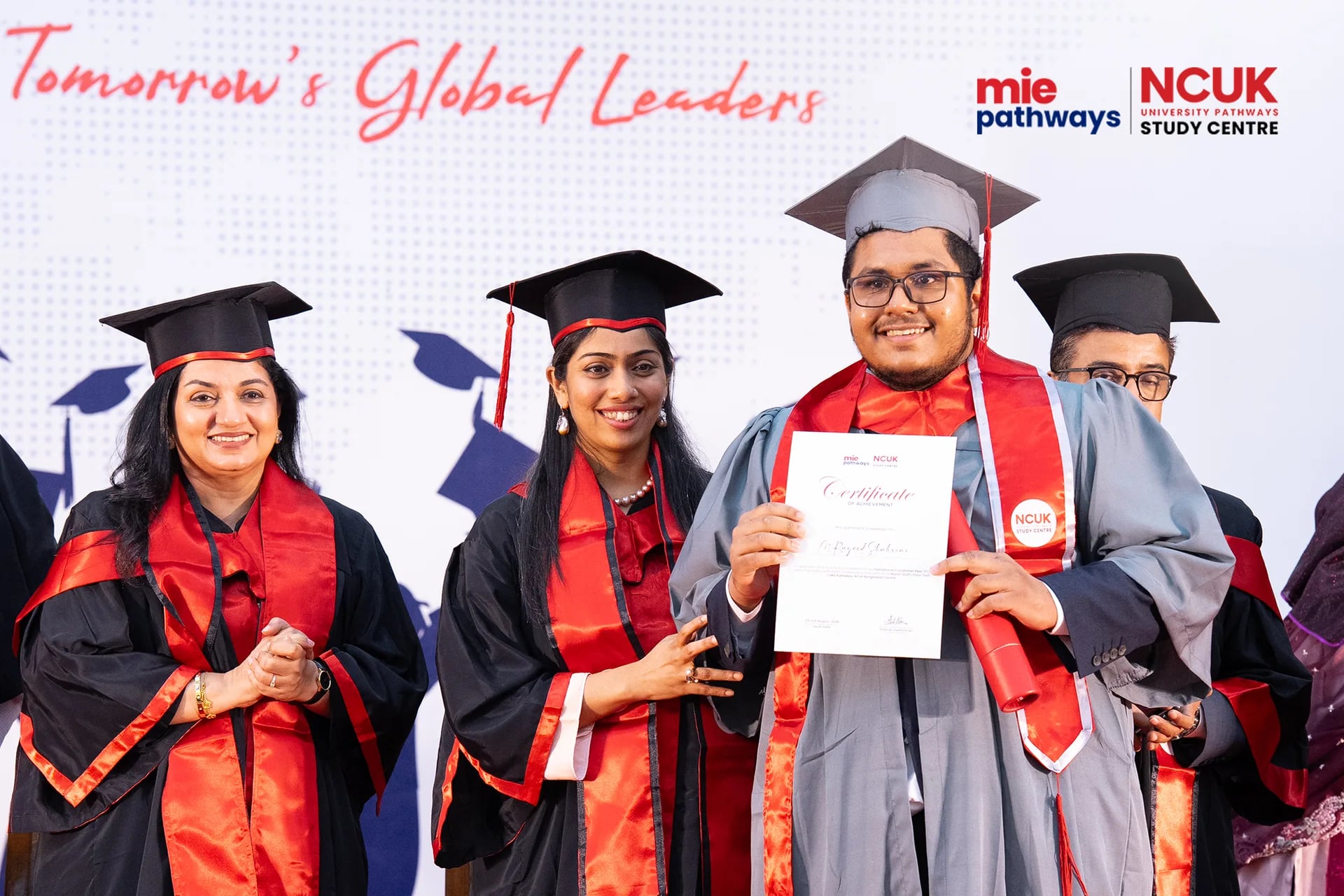 Graduates receiving their certificates at the NCUK Graduation Ceremony 2026 — photo 4