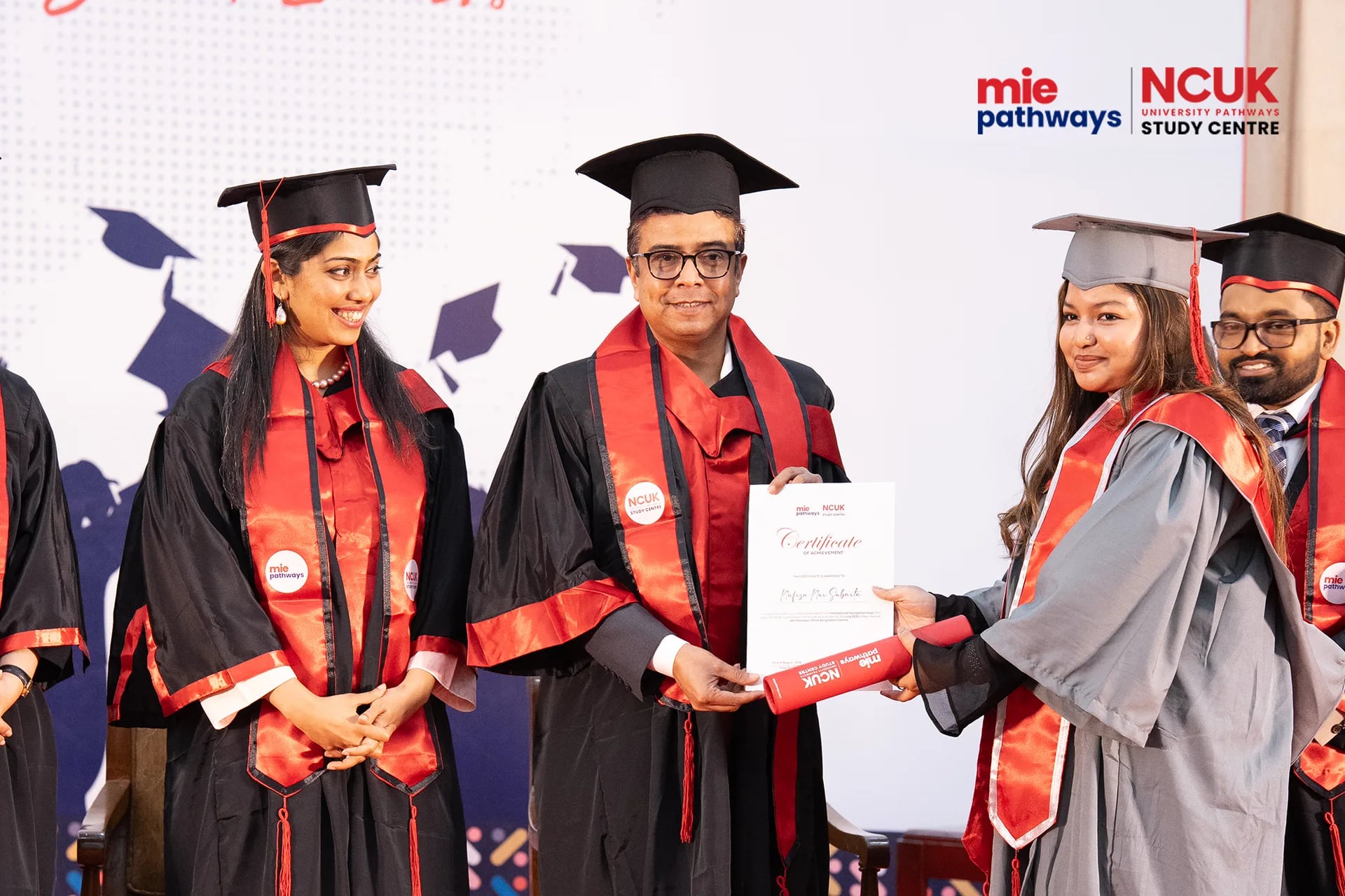 Graduates receiving their certificates at the NCUK Graduation Ceremony 2026 — photo 9