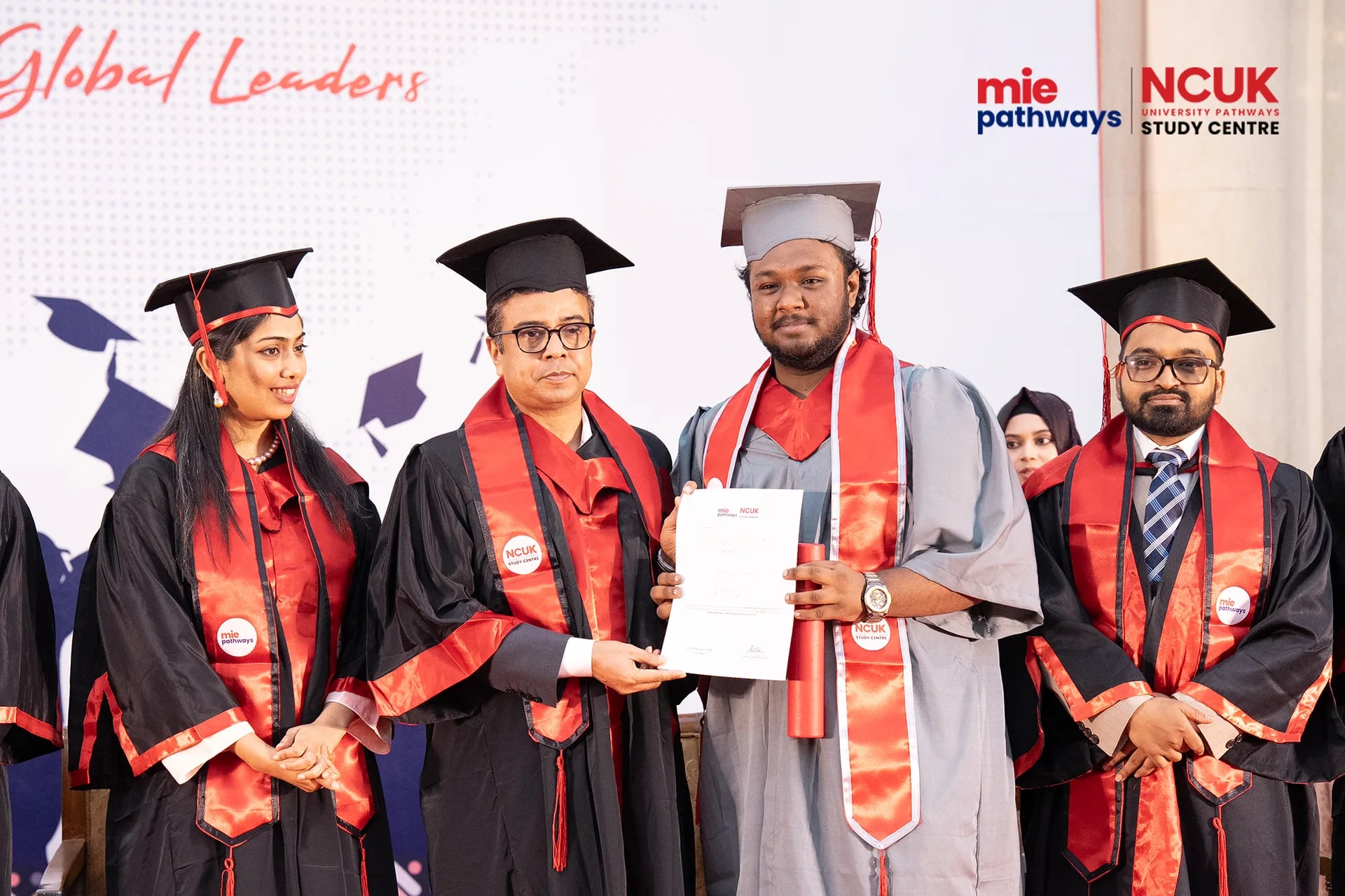 Graduates receiving their certificates at the NCUK Graduation Ceremony 2026 — photo 10