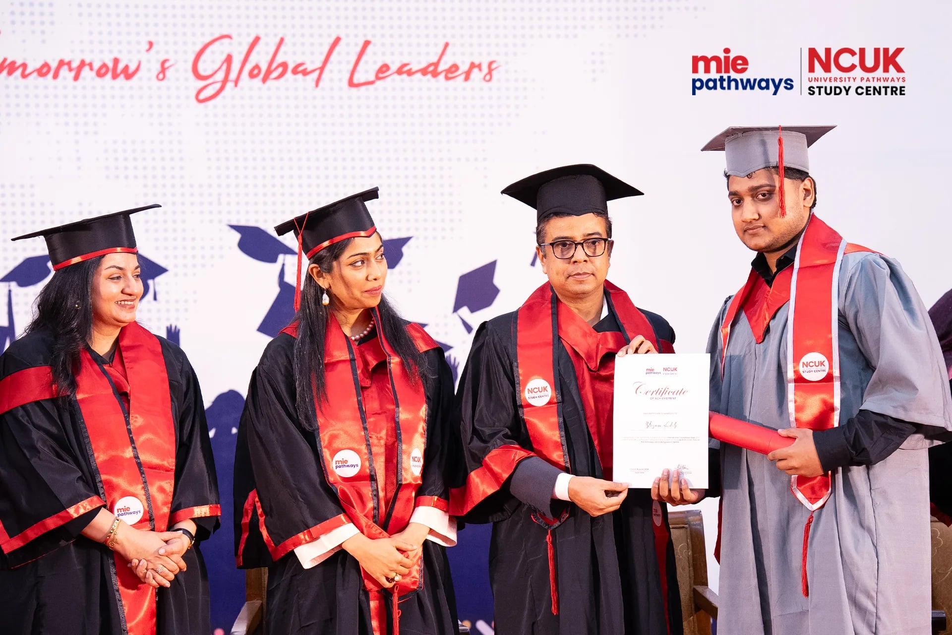 Graduates receiving their certificates at the NCUK Graduation Ceremony 2026 — photo 13