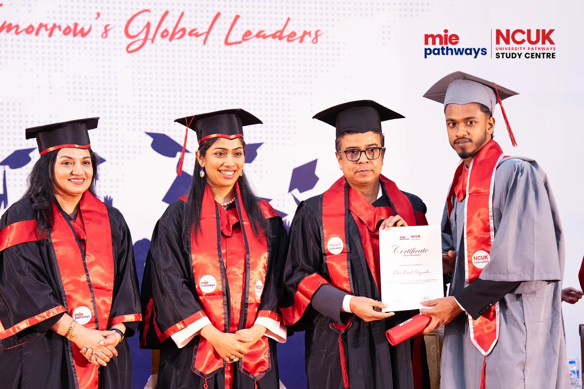 Graduates receiving their certificates at the NCUK Graduation Ceremony 2026 — photo 14