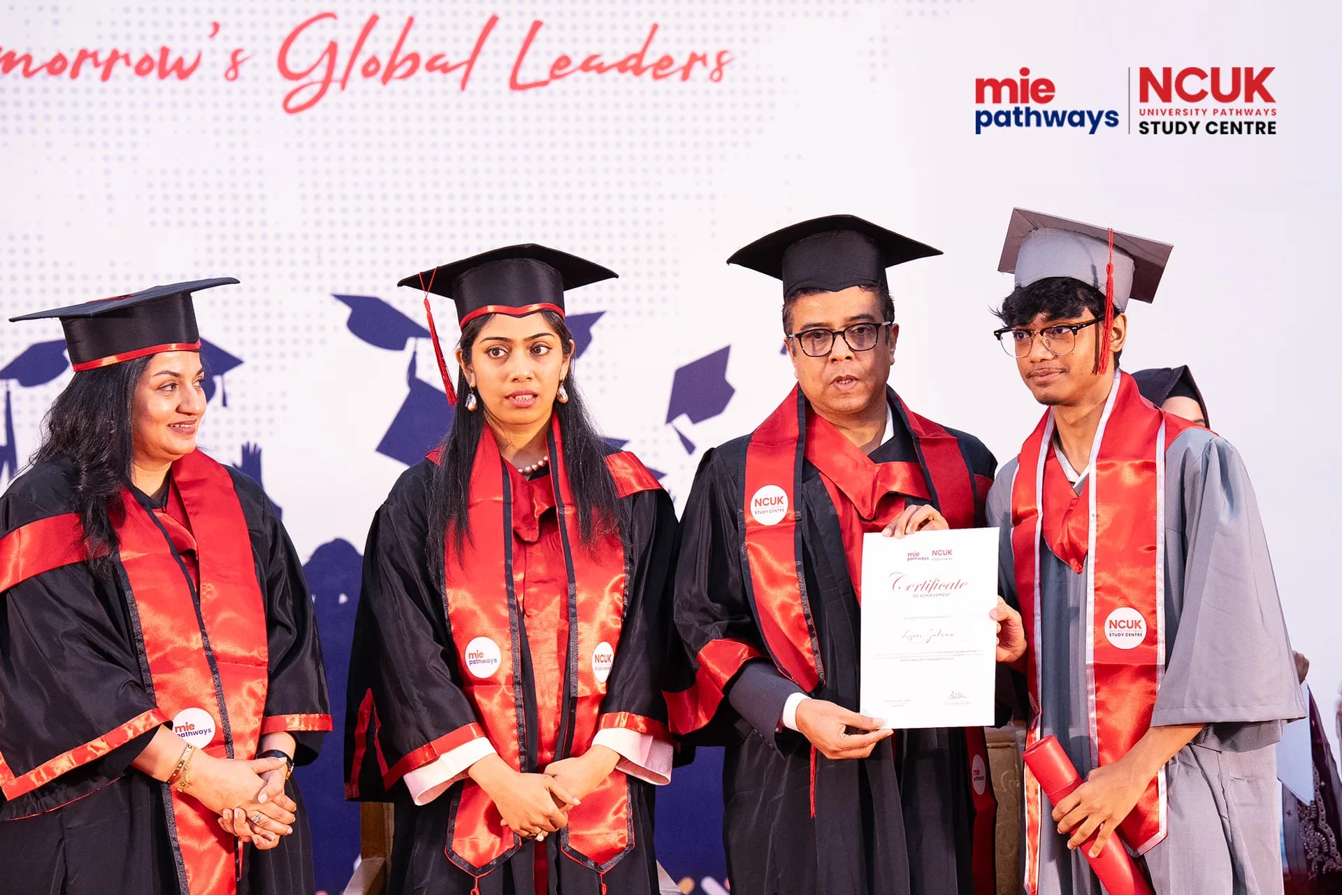 Graduates receiving their certificates at the NCUK Graduation Ceremony 2026 — photo 17