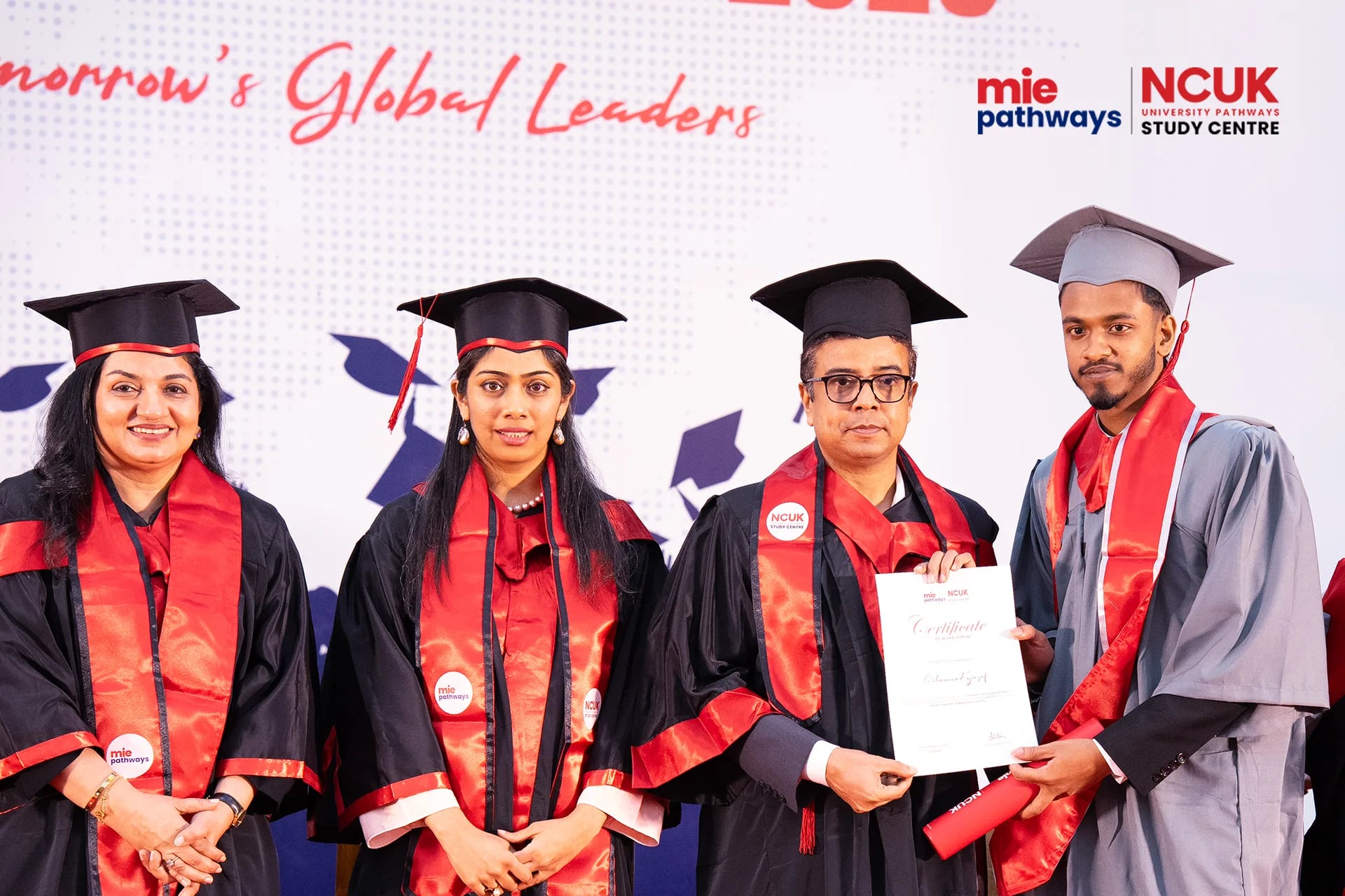 Graduates receiving their certificates at the NCUK Graduation Ceremony 2026 — photo 19