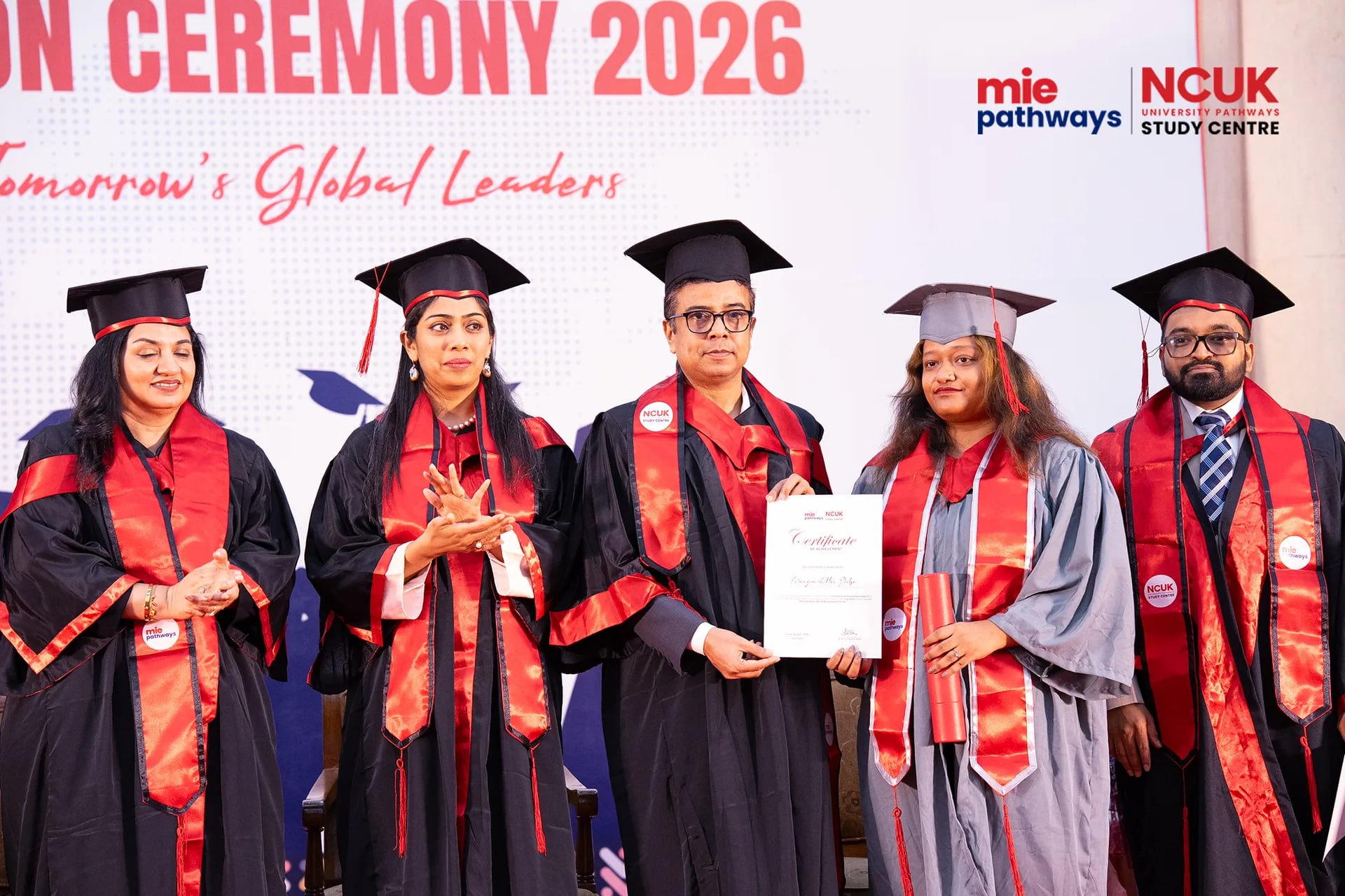 Graduates receiving their certificates at the NCUK Graduation Ceremony 2026 — photo 20