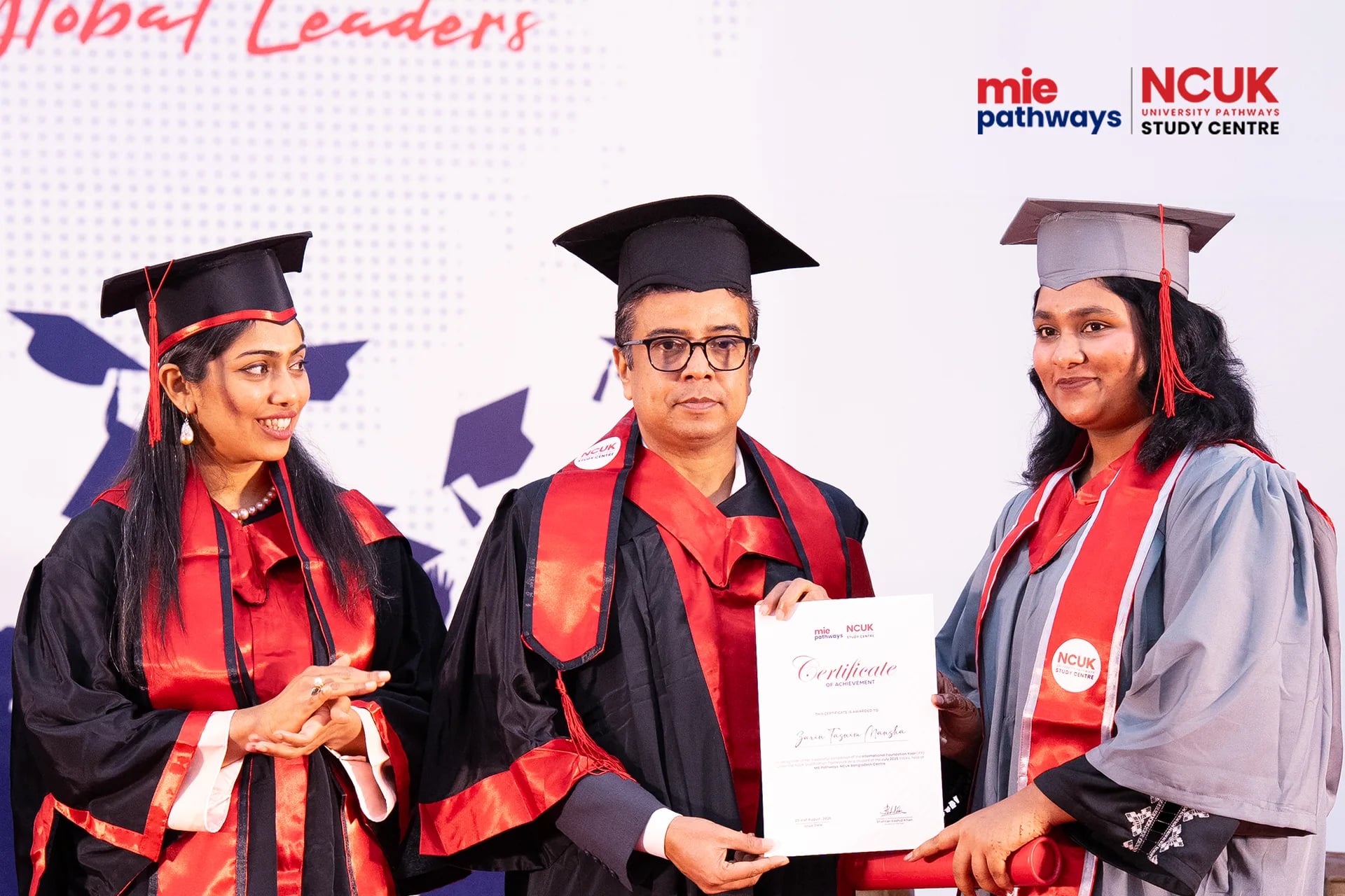 Graduates receiving their certificates at the NCUK Graduation Ceremony 2026 — photo 24