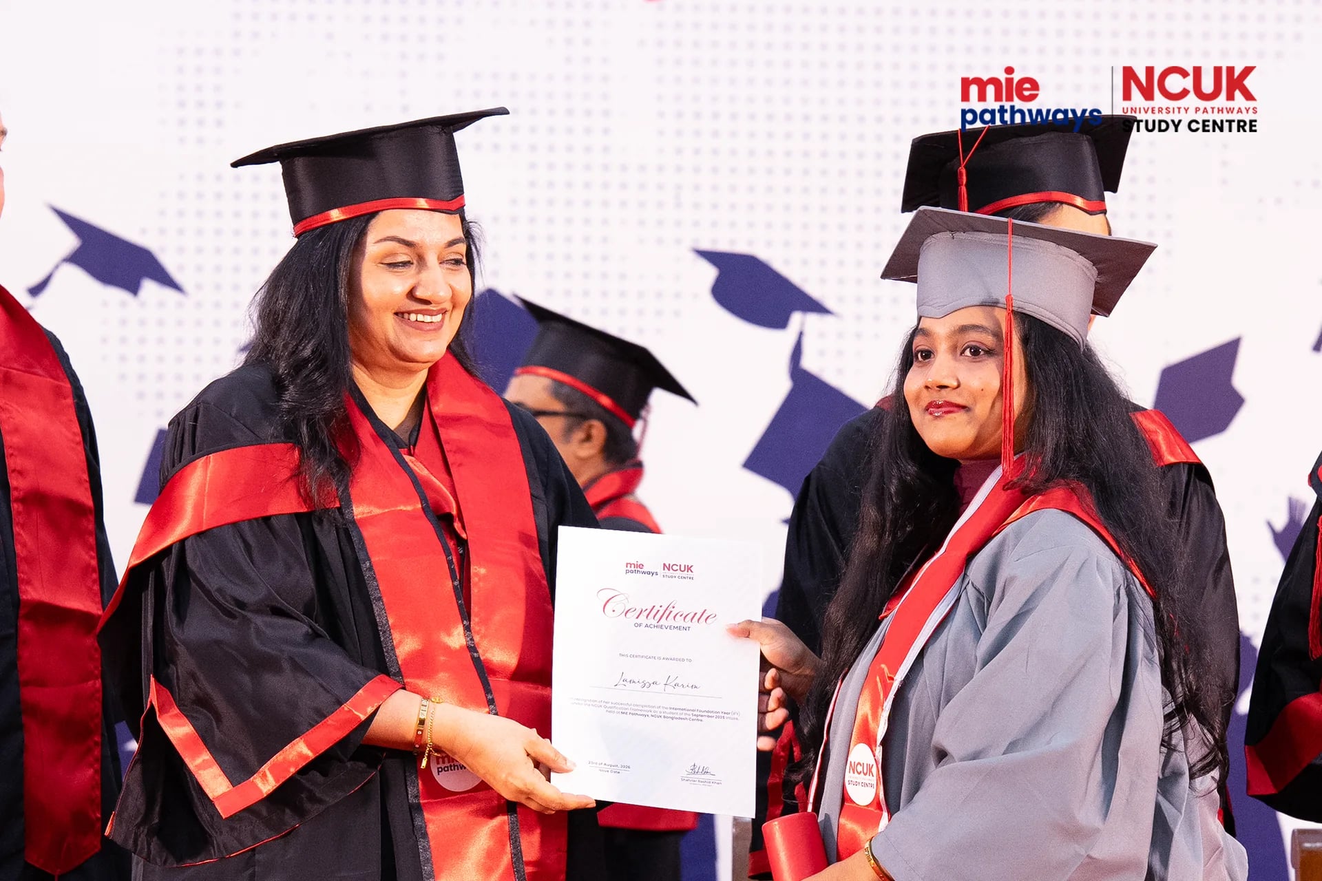 Graduates receiving their certificates at the NCUK Graduation Ceremony 2026 — photo 25
