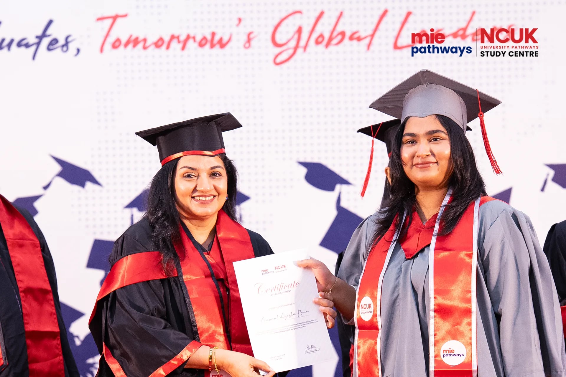Graduates receiving their certificates at the NCUK Graduation Ceremony 2026 — photo 26