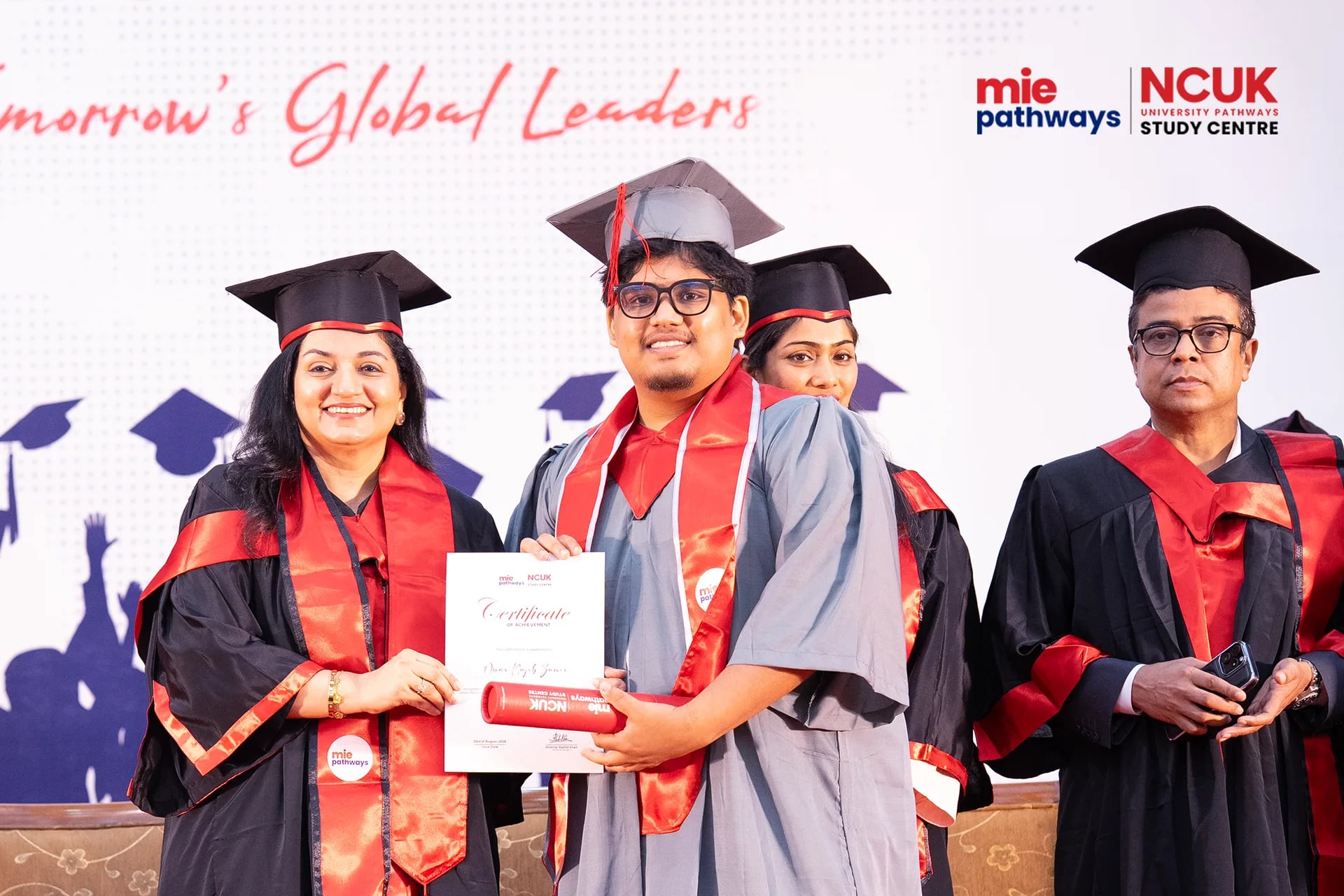 Graduates receiving their certificates at the NCUK Graduation Ceremony 2026 — photo 33