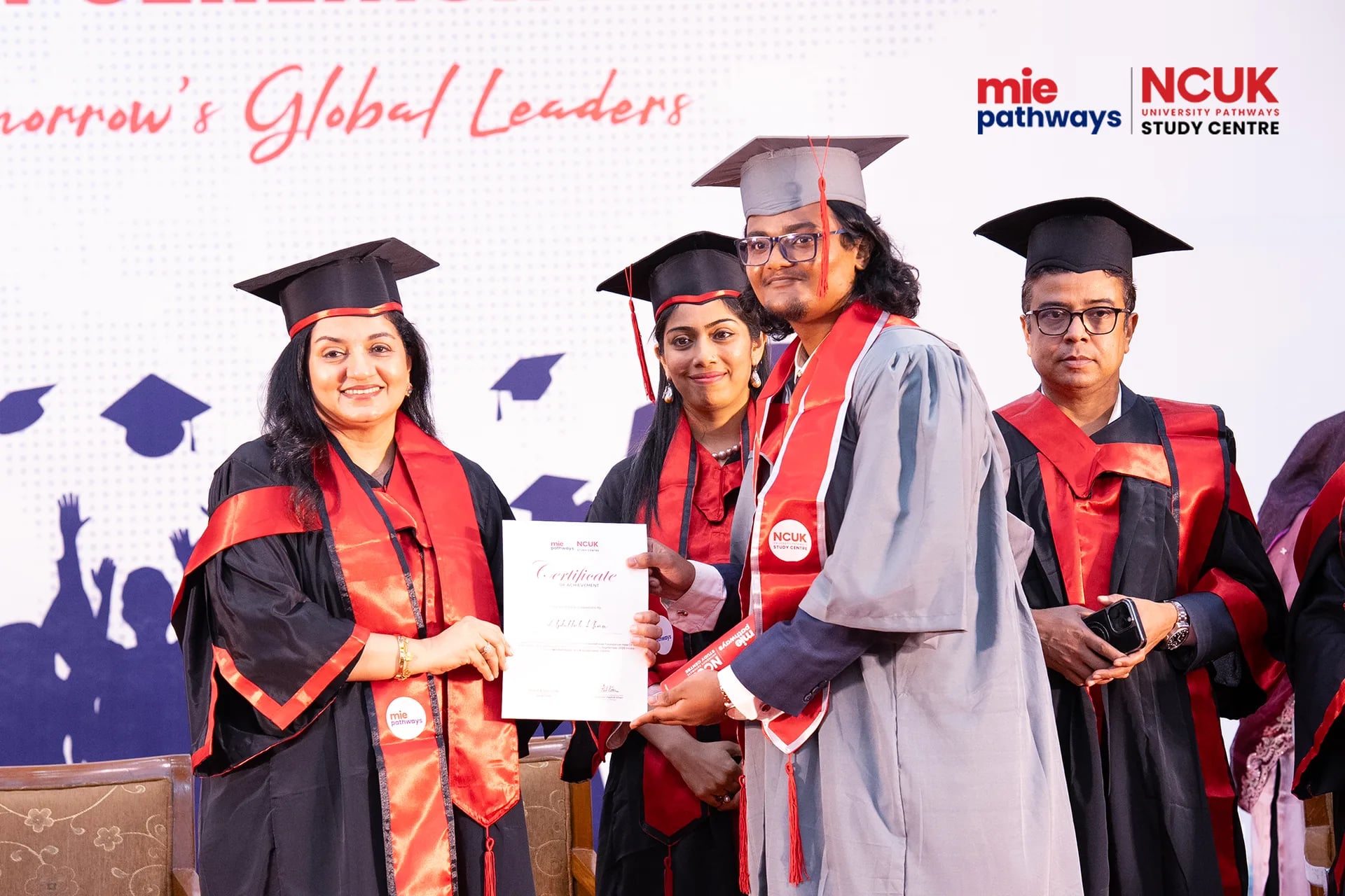Graduates receiving their certificates at the NCUK Graduation Ceremony 2026 — photo 39