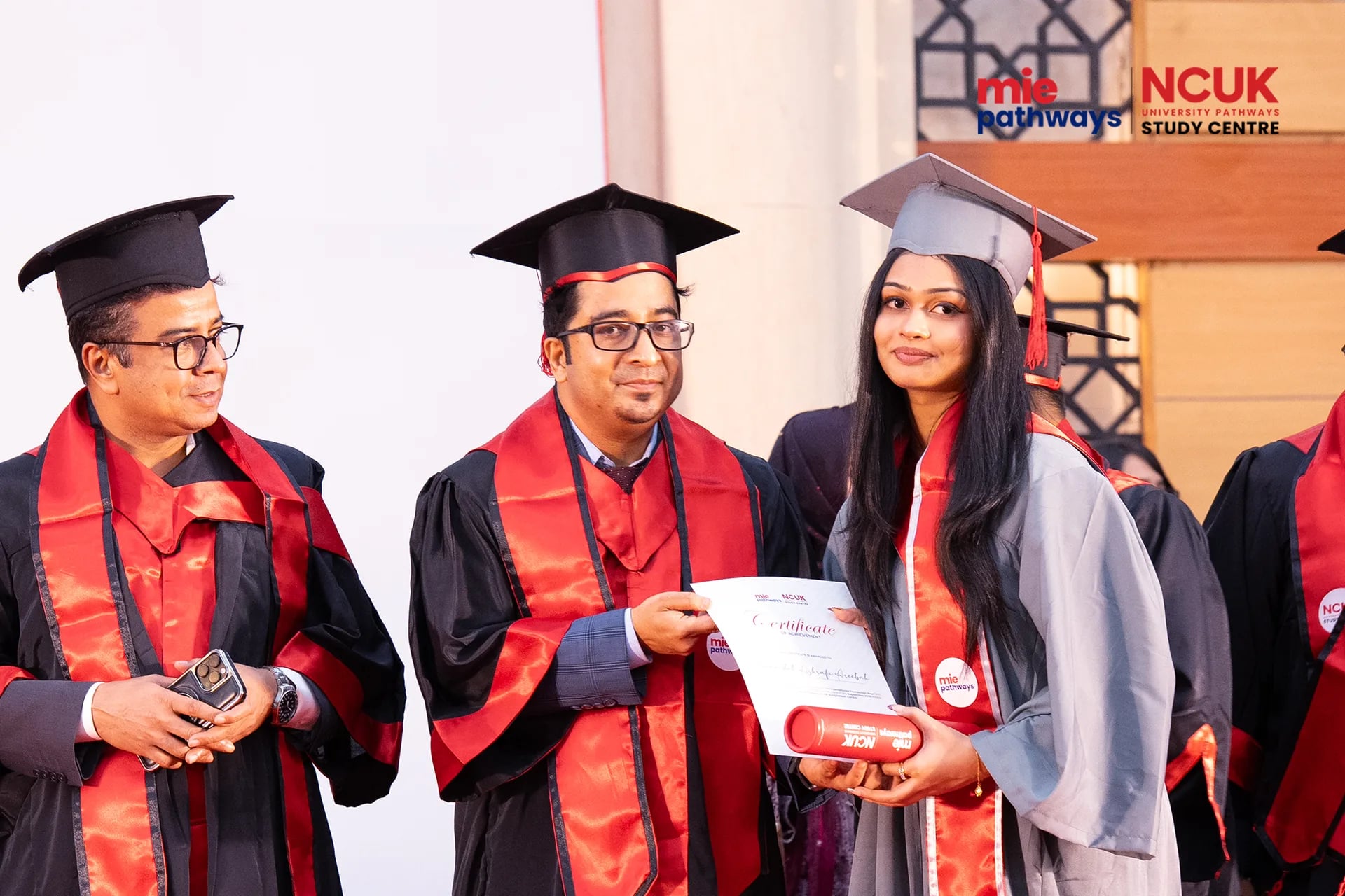 Graduates receiving their certificates at the NCUK Graduation Ceremony 2026 — photo 41