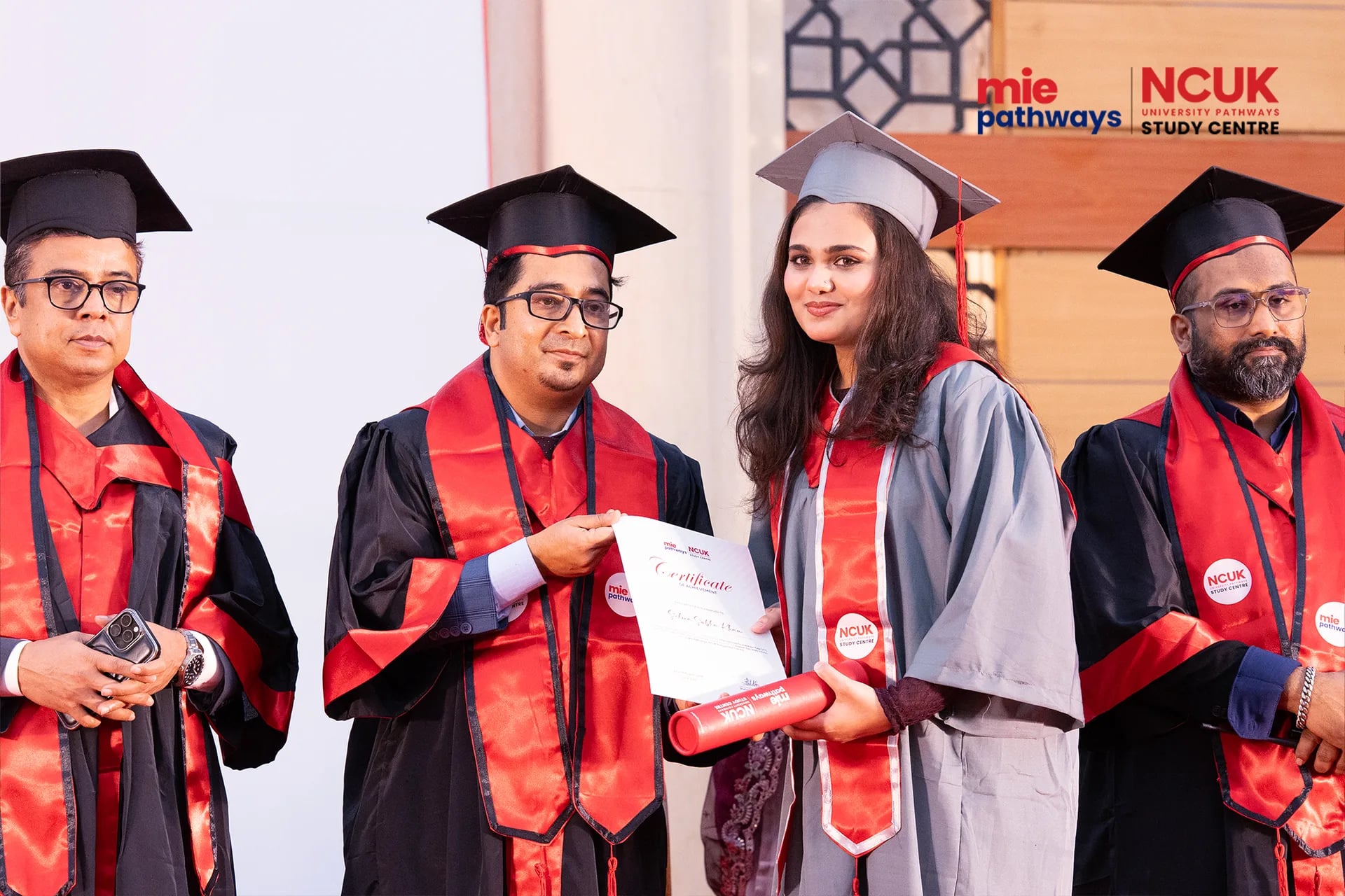 Graduates receiving their certificates at the NCUK Graduation Ceremony 2026 — photo 42