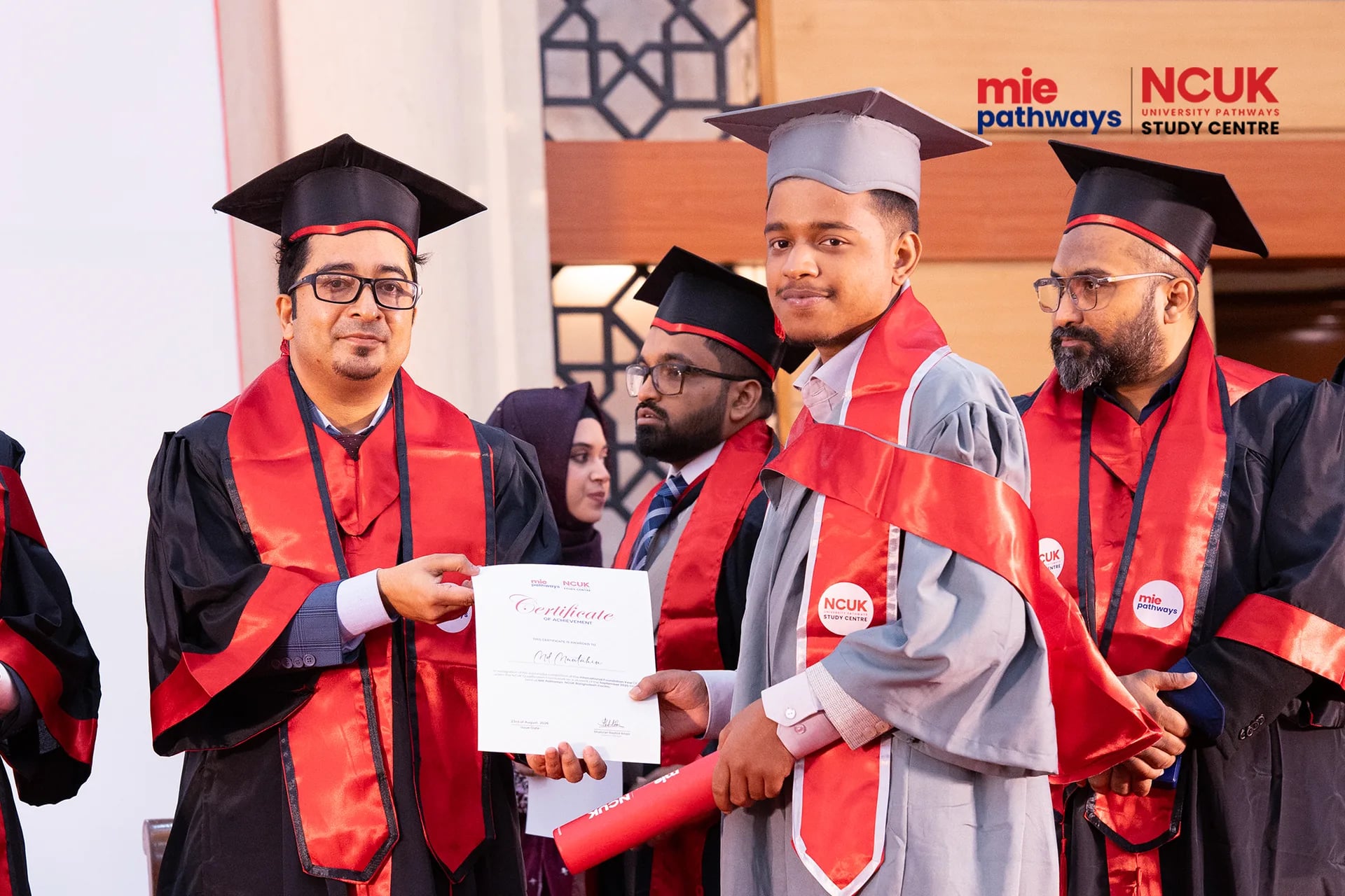 Graduates receiving their certificates at the NCUK Graduation Ceremony 2026 — photo 43