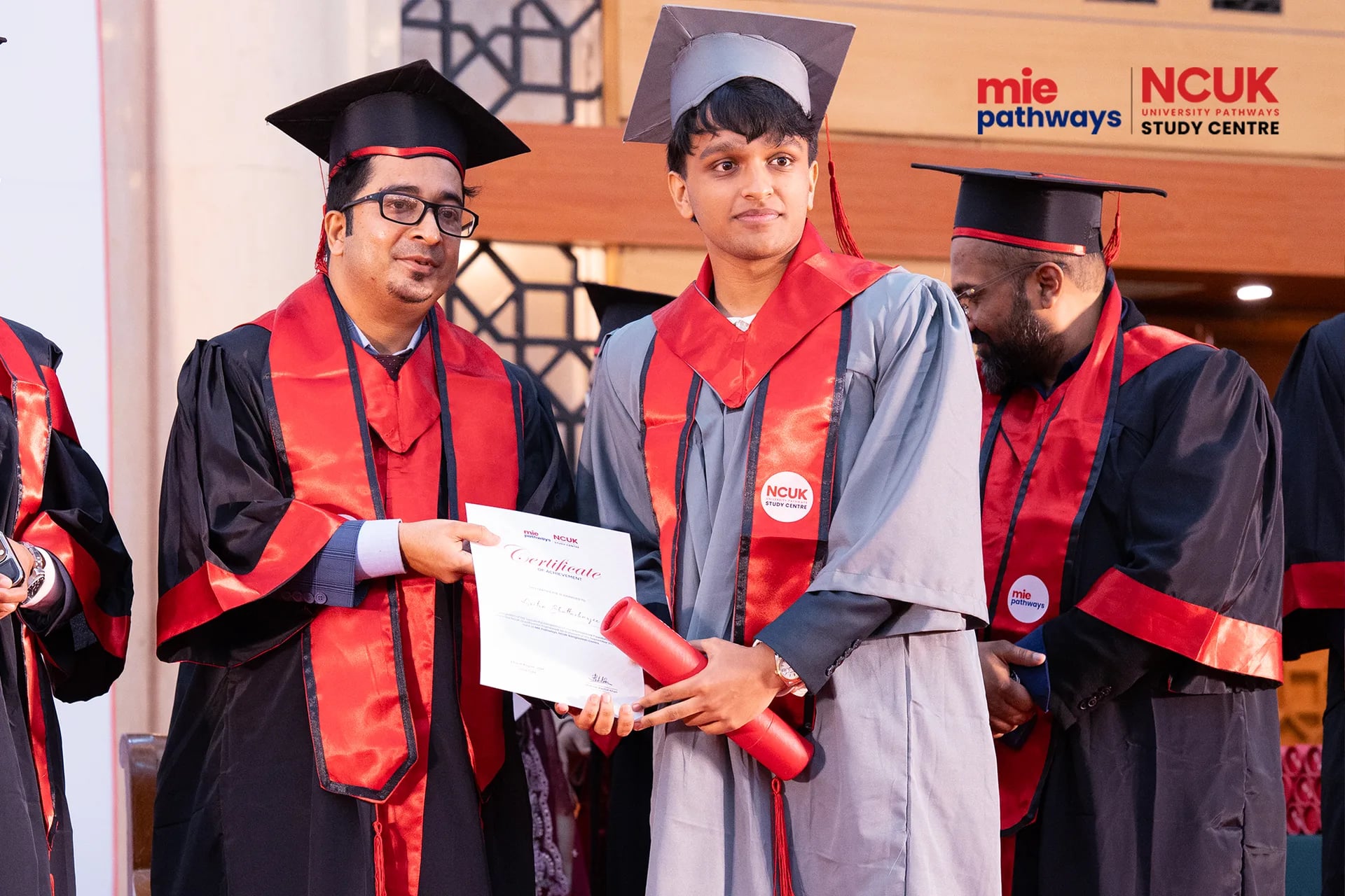 Graduates receiving their certificates at the NCUK Graduation Ceremony 2026 — photo 44