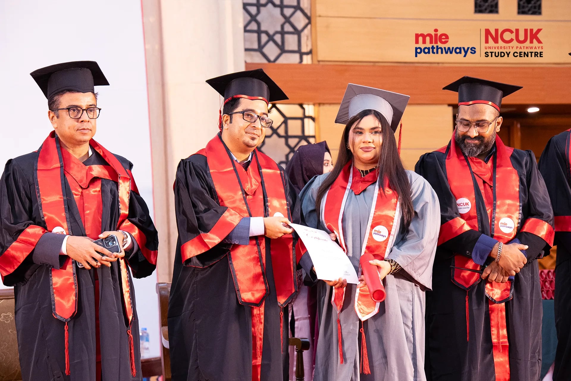 Graduates receiving their certificates at the NCUK Graduation Ceremony 2026 — photo 45