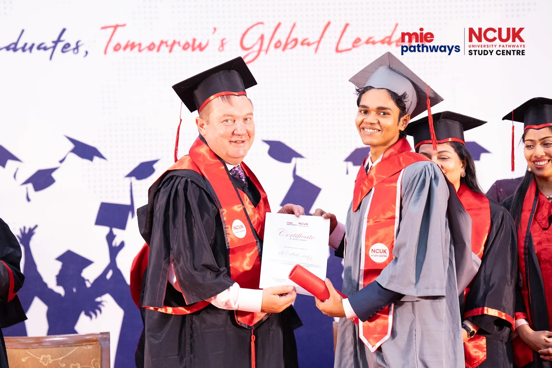 Graduates receiving their certificates at the NCUK Graduation Ceremony 2026 — photo 48